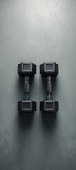 Pair of Dumbbells on Concrete Floor