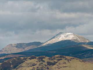 Fototapeta premium Snow dusted Ben Lomond on a cloudy day, from Queen's View on the A809 road between Milngavie and Drymen north of Glasgow, Scotland. OS map ref NS 511 808.