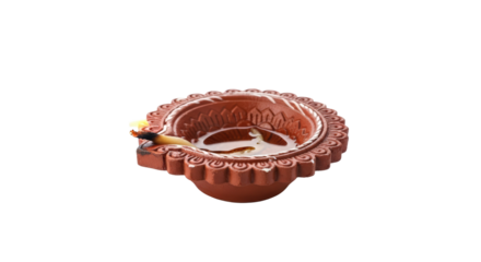 Ornate copper diya oil lamp with intricate detailing for spiritual and decorative use isolated on transparent background