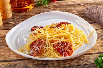 Italian classic spaghetti carbonara with bacon and egg
