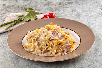 Italian pasta fettuccine with prosciutto