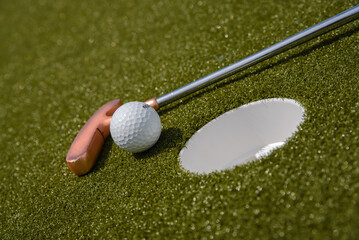 golf mallet on the green, artificial turf