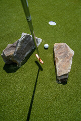 golf mallet on the green, artificial turf
