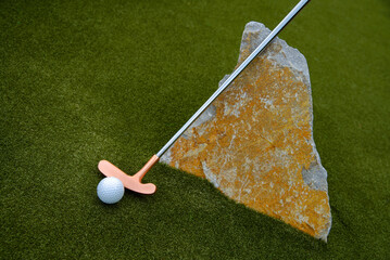 golf mallet on the green, artificial turf