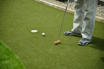 golf mallet on the green, artificial turf