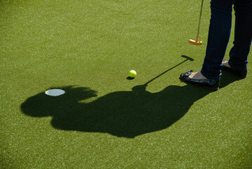 golf mallet on the green, artificial turf