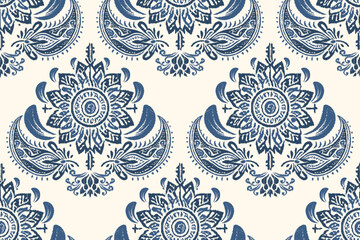 Seamless damask pattern is navy blue with a cream background. Motif Ikat floral embroidery folklore ornament.ethnic oriental stamped appearance. Inspired by traditional Asian or Indian design.