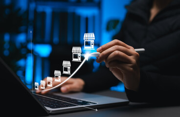 Retail Store Expansion and Franchise Growth Strategy Concept. Person draws upward curve connecting multiple storefront icons, symbolizing retail growth, franchise development and expansion strategy.