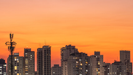 Obraz premium The skyline of the north part of Sao Paulo, during blue hour and sunset. August 31, 2025. Sao Paulo, Brazil.