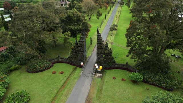 Cinematic Aerial of the Handara Gate (Candi Bentar) in Bali, Indonesia | Lush Tropical Entrance