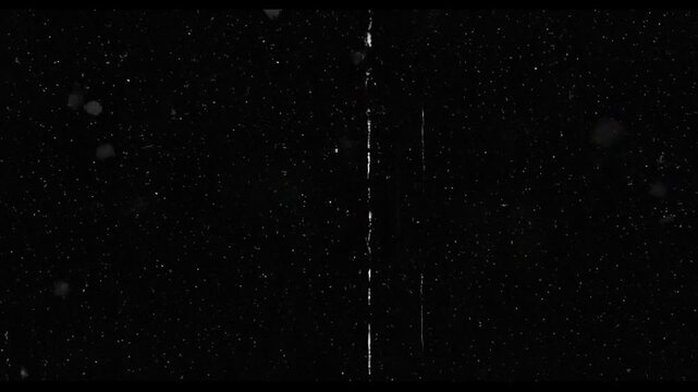 Dust and scratches with film light leaks and noise effects. Film noise grain texture Retro vintage and light leak.Seamless looping video