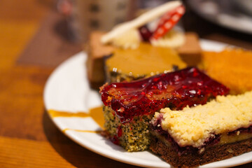 Delicious Array of Colorful Desserts Showcasing a Variety of Flavors and Textures on a White Plate Perfect for Any Sweets Lover
