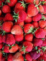Strawberries background. Fresh strawberries close up. Top view. Close-up, selective focus.