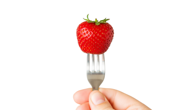 A sweet, fresh, and red strawberry is held in a hand, ripe and ready to be a healthy snack isolated on white background.