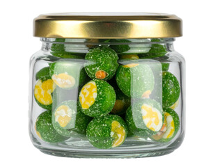 Small glass jar filled with green, coated, round snacks with golden lid