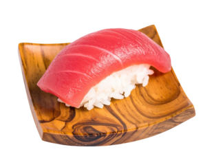 Nigiri sushi with red fish atop white rice, presented on a wooden square plate