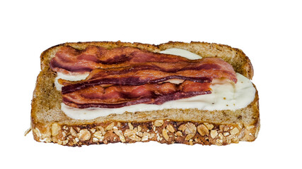 Sliced whole grain bread is generously layered with melted cheese and topped with crispy bacon strips, making it an inviting choice for a hearty breakfast /transparent PNG file/