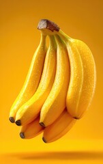 Fresh Wet Bananas with Water Drops on Orange Background