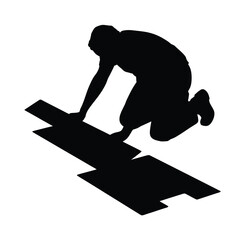 Silhouette of a person laying flooring or tiling on the floor