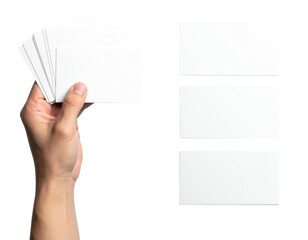 Human hand holding a stack of blank rectangular cards next to three isolated