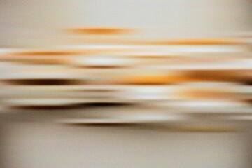 Soft beige and gold motion blur abstract art creating elegant smooth transitions and warm futuristic minimal texture for modern visuals.