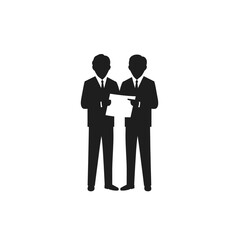 Silhouette of a person sitting at a desk with a laptop, working or studying.