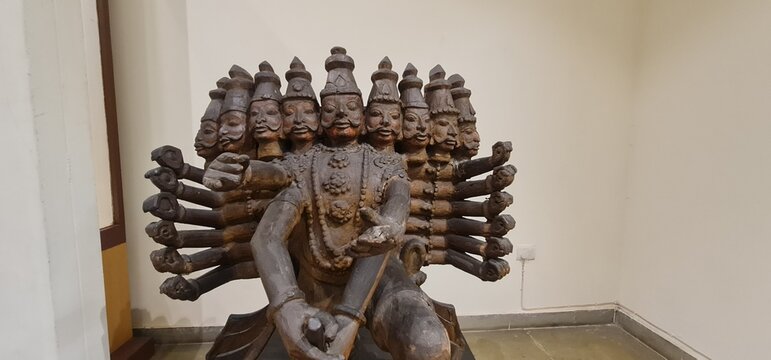 Wooden Ravana Statue with Multiple Heads and Arms at the National Crafts Museum and Hastkala Academy in New Delhi, India