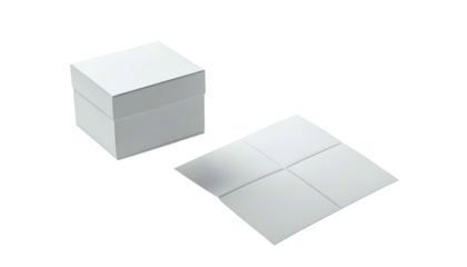 A white square box with a lid sits beside a folded white square. Dark background
