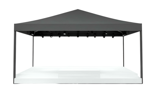 A black-roofed, rectangular canopy structure atop a white stage, empty inside