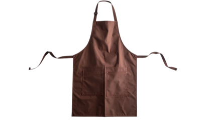 Flat lay shot of a brown kitchen apron with two pockets, long straps, and a dark background