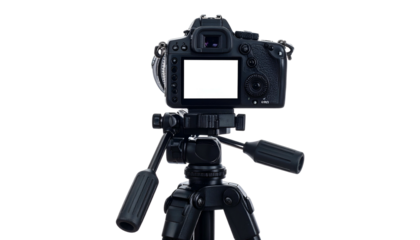 A professional camera mounted on a tripod, back view, with a blank screen, against black