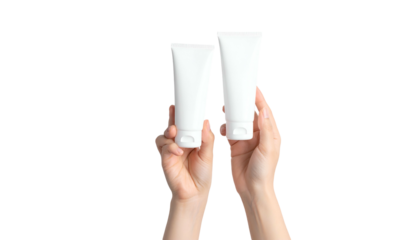 Two white tubes held by hands against a black background, suggesting product presentation