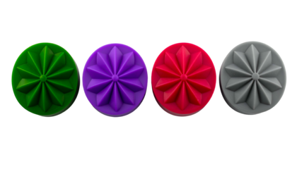 Four colorful, circular objects featuring a stylized geometric star design against a black background