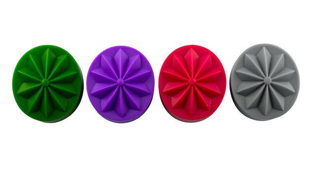 Four colorful, circular objects featuring a stylized geometric star design against a black background