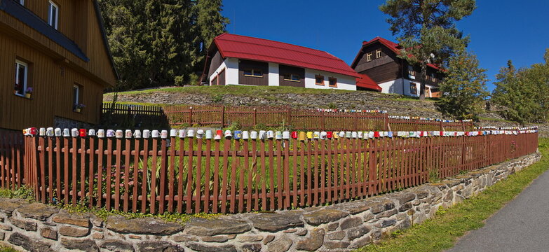 Residential house with decorated fence in Modrava in Bohemian Forest,Czech republic,Europe
