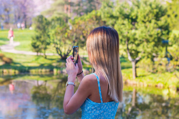 young woman taking a picture of themselves