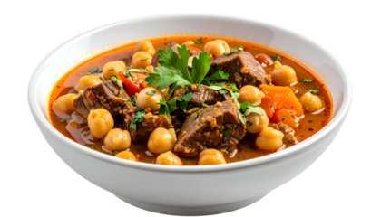 Hearty stew of chickpeas, meat chunks, veggies, herbs in a vibrant broth, served in a bowl