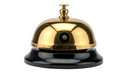 Shiny brass bell with a black base, isolated on a solid black background