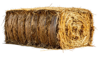 A large, rectangular hay bale showing stacked cylindrical rolls. Warm, golden color