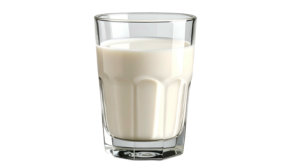 A clear glass filled with creamy, opaque liquid against a stark black background