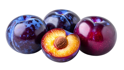 Four ripe plums, one sliced open revealing a golden interior and a central pit