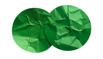 Two crumpled, circular sheets of green paper, possibly overlapping, against a black background