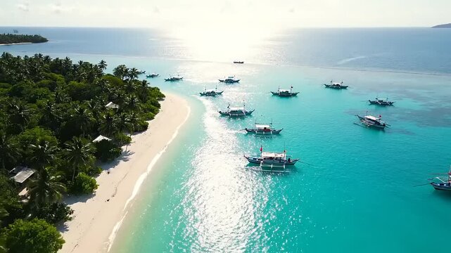 Aerial drone view of a breathtaking tropical island with a pristine white sand beach blue water
