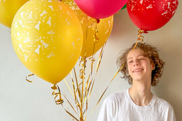 Smiling Teen With Colorful Balloons Indoors During Daylight For Concepts Of Birthday Joy, Youthful Celebrations, Positive Emotions, Self-Love Moments, And Wholesome Visuals For Teen Lifestyle Projects