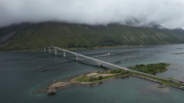 Drone aerial 4k footage of fredvang bridges stretches over tranquil waters, linking several fjiords. Nordland transportation infrastructure, lofoten islands, Norway	