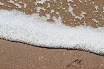   Wave on sand