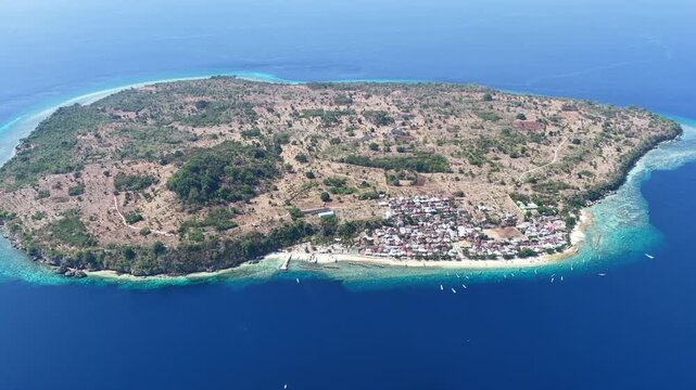The beautiful island of Pulau Buaya, also known as Ternate, sits in Pantar Strait, near Alor, Indonesia. This area is known for its diverse coral reefs and spectacular scuba diving and snorkeling.