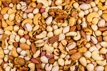 Background of the various nuts (almond, cashew, hazelnut, pistachio, walnut). Vegetarian meal. Healthy eating concept