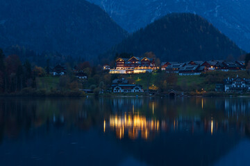 Fototapeta premium The beautiful mountain lake Grundlsee at the southern foot of the Totes Gebirge mountains in the Styrian part of the Salzkammergut in Austria