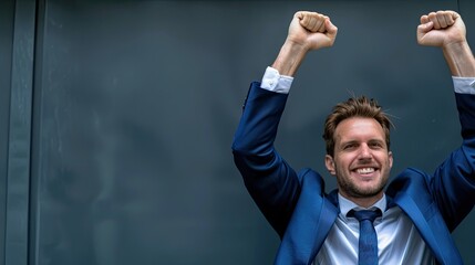 Celebrating success joyful businessman in a suit urban environment portrait professional lifestyle positive emotions